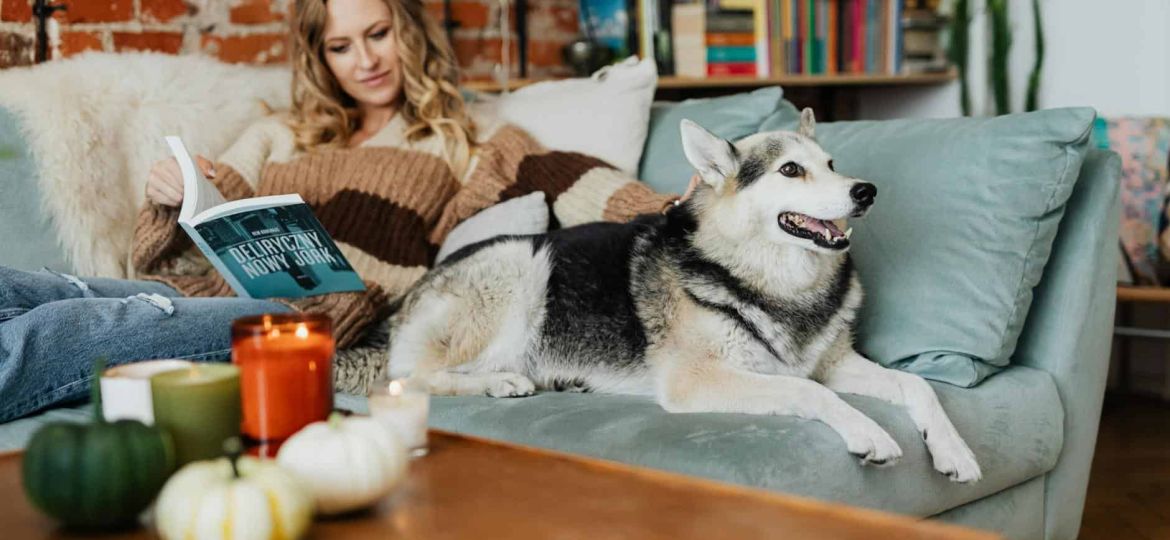 woman petting her siberian husky dog